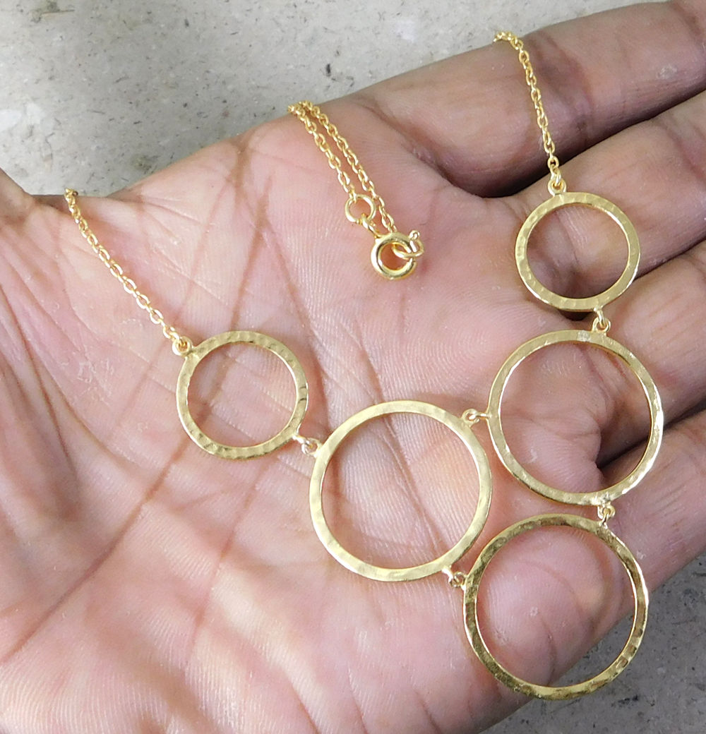 Goud vergulde ketting met ringen hanger