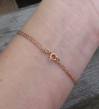 Vergulde armband met ronde Smokey Topaas en Robijnen