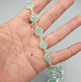 Zilveren ketting rond om gezet met ronde facet aqua Chalcedoon