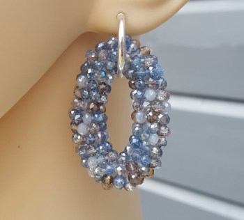 Zilveren creolen met ovale hanger van blauw grijze kristallen