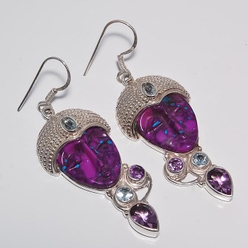 Zilveren oorbellen met gezicht uit paars Turkoois