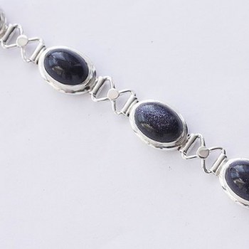 Zilveren armband gezet met ovale blauwe Goudstenen